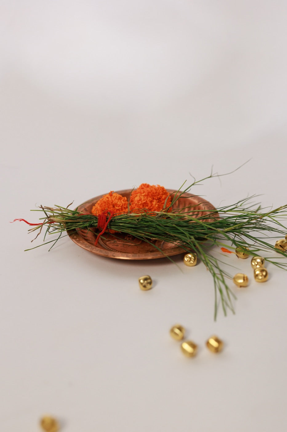 Marigold, ghungroo and durva